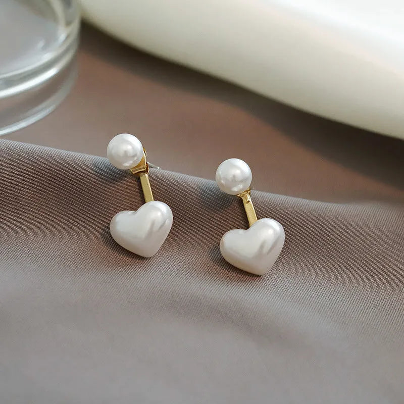 Heart-shaped stud earrings with artificial pearl gemstones in Korean style design