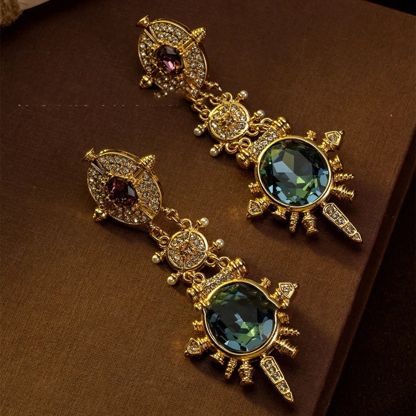 Pair of geometric gold retro stud earrings with diamond treatment surface