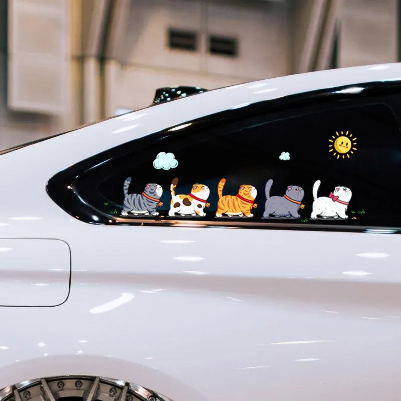 Five climbing cats car sticker on vehicle window showing PVC waterproof decal with humorous animal design