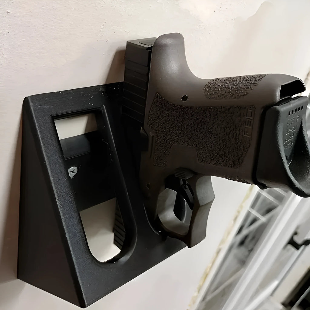 Black plastic pistol stand with punk-style design for displaying model firearms