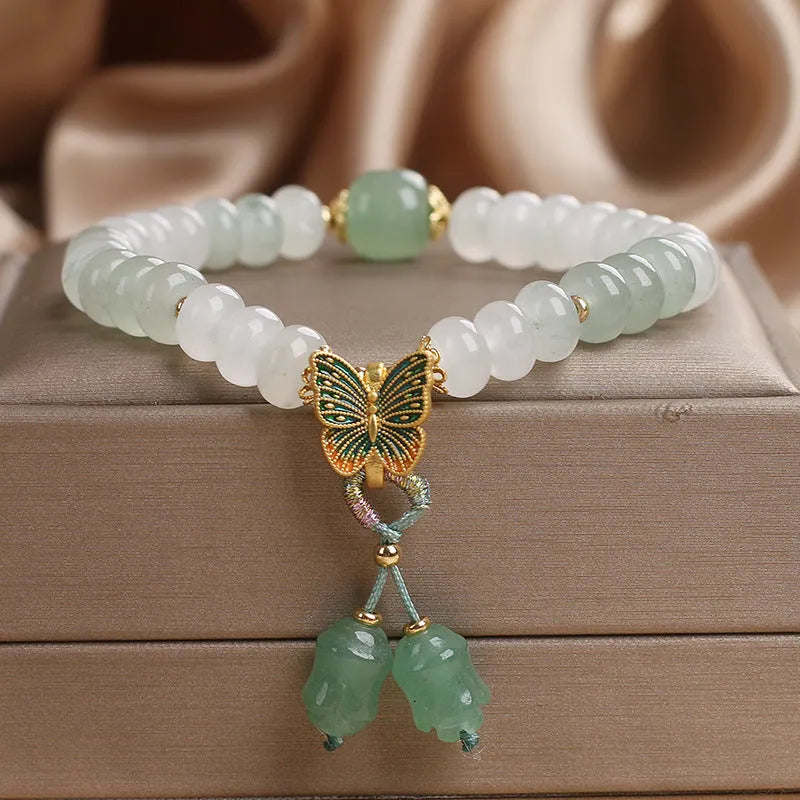 Green retro butterfly tassel bracelet with crystal beads, pearls, and rhinestones
