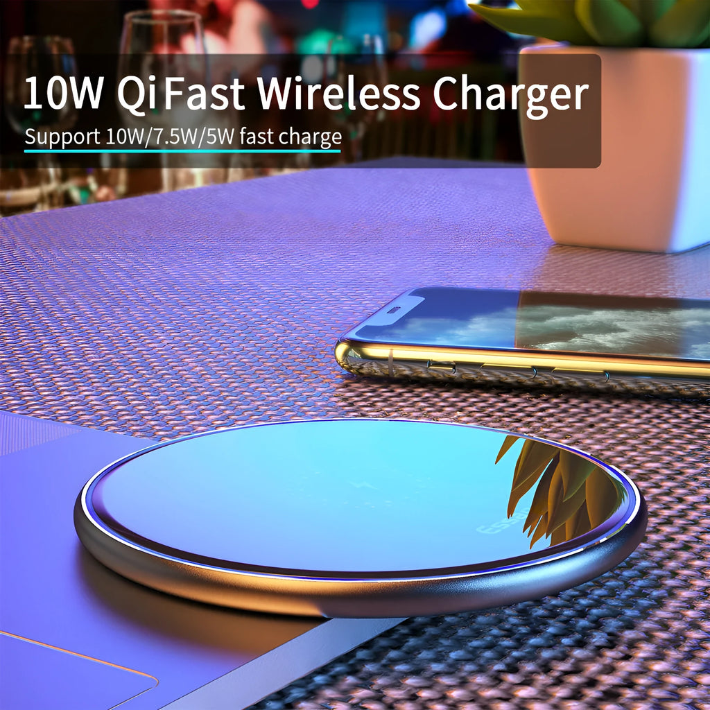 Black or white aluminium alloy wireless charging pad with LED status light on desk.