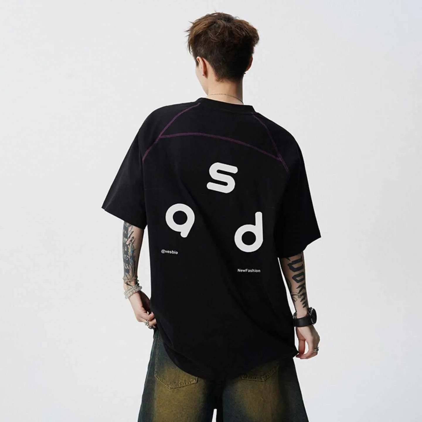 Loose fit cotton short sleeve t-shirt with letter print, shown in black and white colour options.