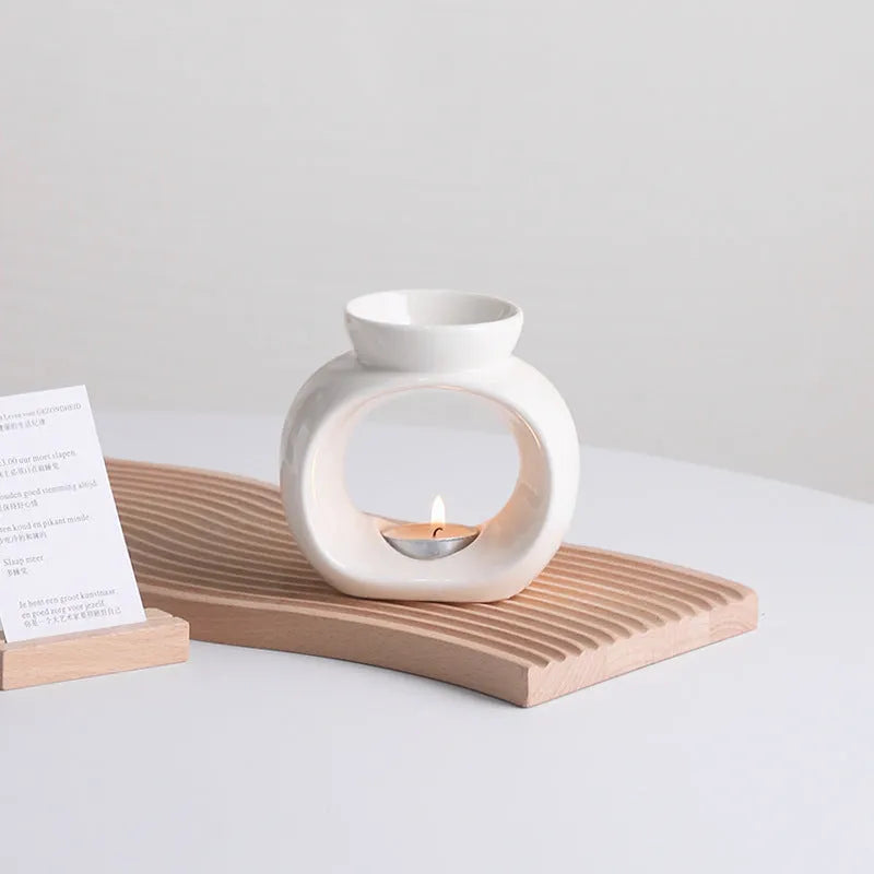 White Nordic style ceramic aromatherapy stove ornament on a tabletop