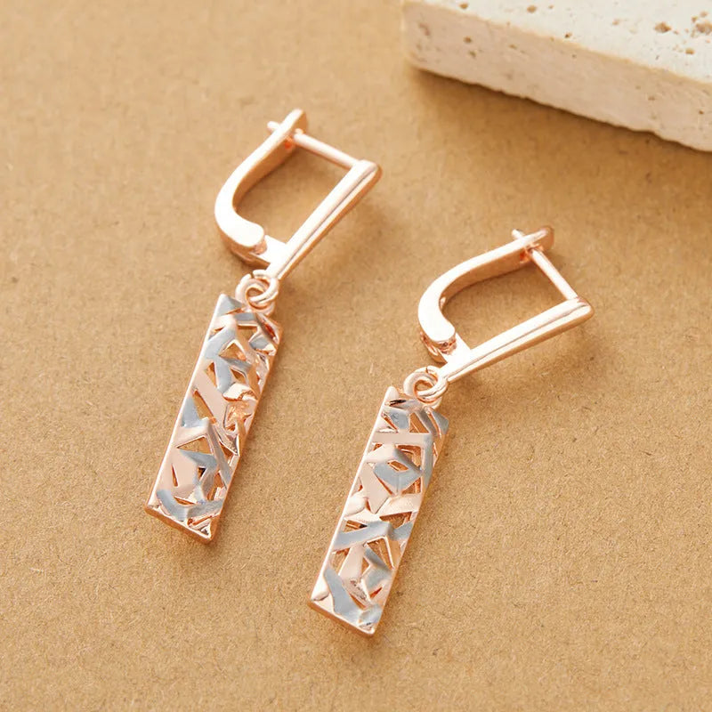 Rectangular hollow stud earrings with two-tone electroplated finish and geometric design
