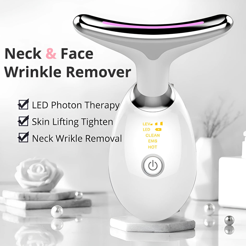 White EMS thermal neck lifting massager device with LED lights, shown with USB cable and moisturiser.