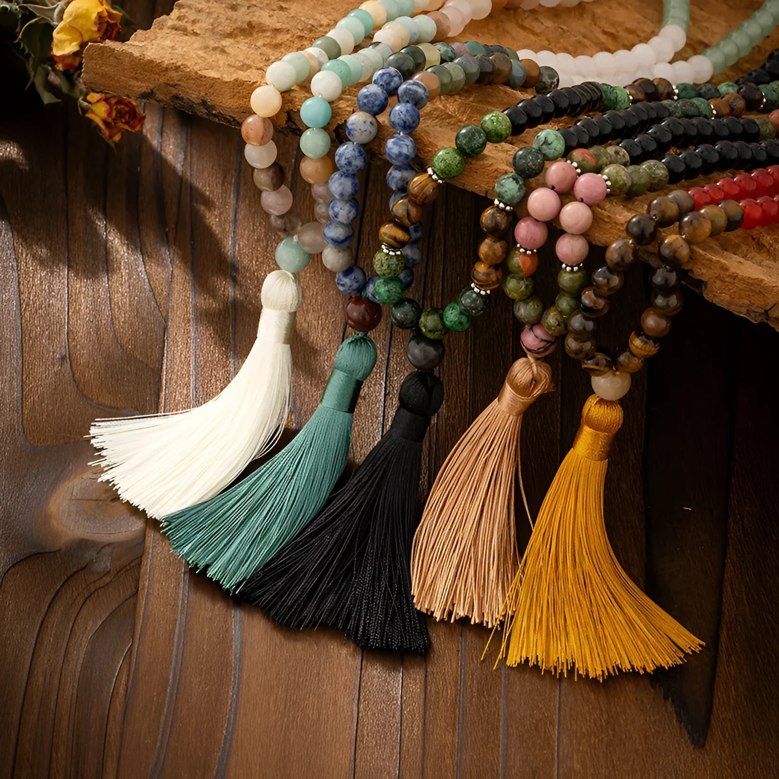 Bohemian style long bead necklace with tassel and matching bracelet on dark background