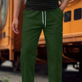 Men's light grey tapered slim-fit trousers with an elastic waistband on a hanger.