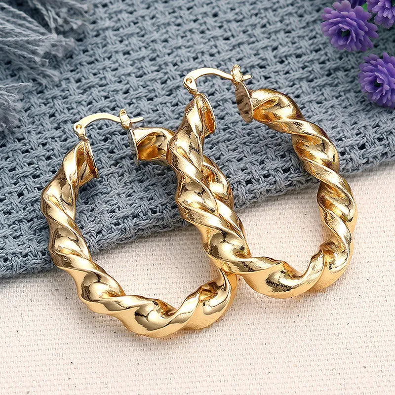 Geometric drop ear clips for women in copper with ring and line design elements