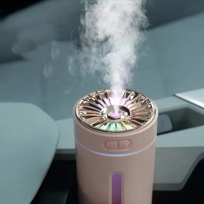 Black USB rechargeable ultrasonic humidifier with LED lights on a car cup holder