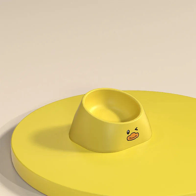 Green tilted stainless steel cat bowl with non-slip white base at a 15 degree angle