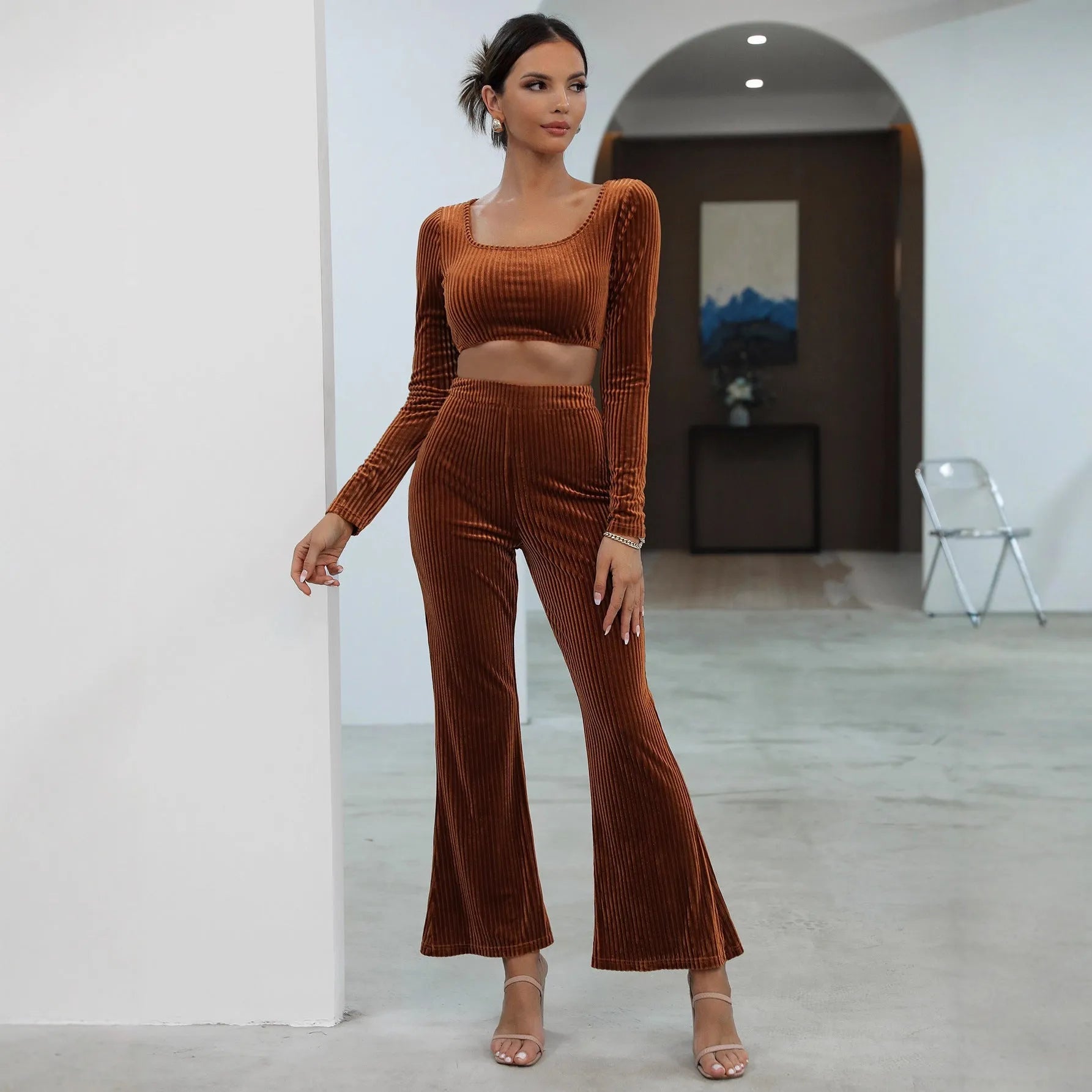 Caramel coloured long sleeve sweater and matching trousers casual set laid flat