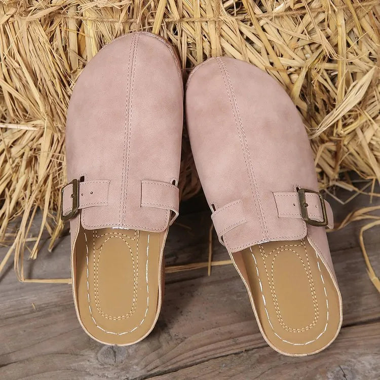 Women's casual wedge slippers in light brown with cloth upper and rubber sole, shown on a foot.