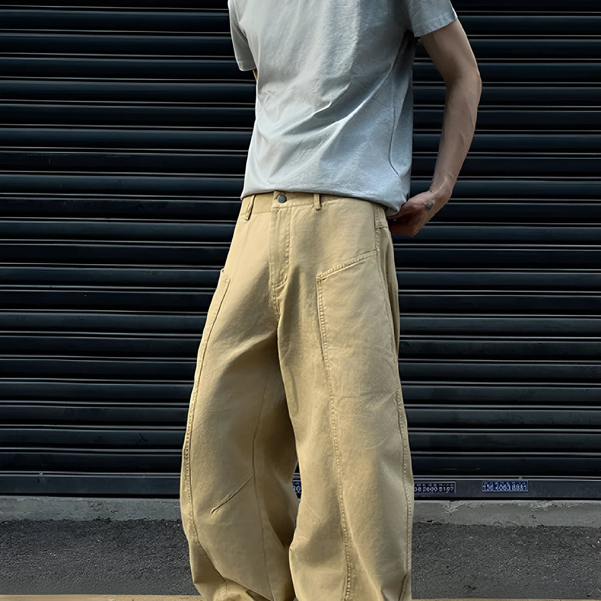 Men's khaki cotton straight-leg trousers laid flat showing solid colour design and casual styling
