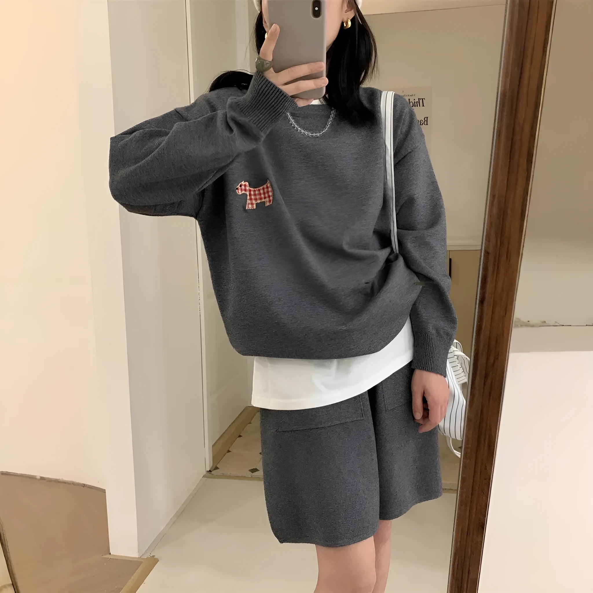 Women's milk blue casual knitted sweater and shorts suit with animal pattern embroidery.