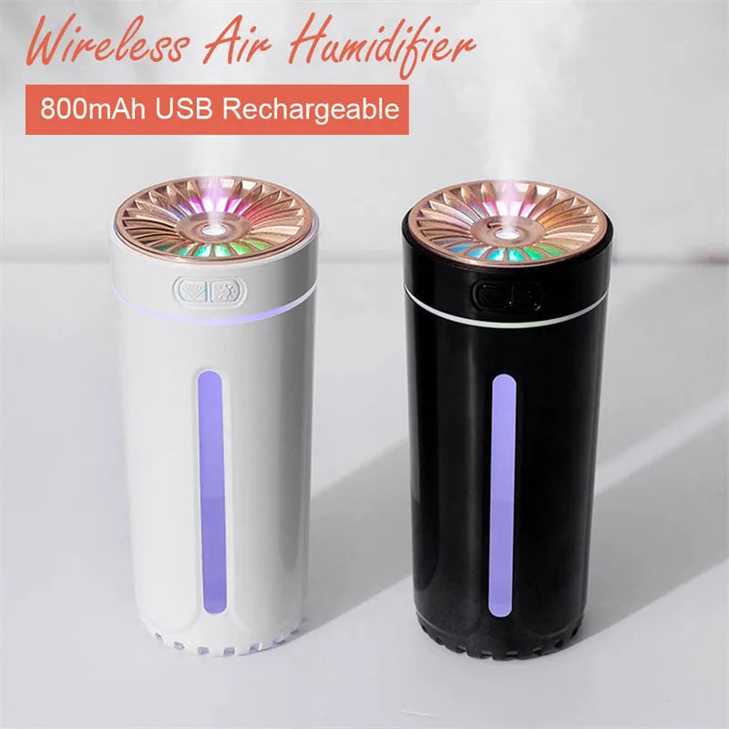 Black USB rechargeable ultrasonic humidifier with LED lights on a car cup holder