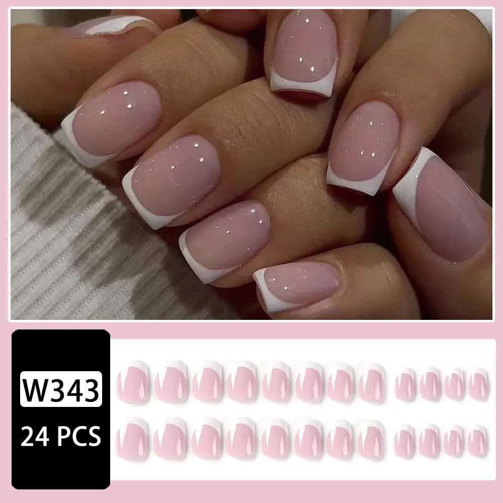 Twenty-four white plaid pattern fake nails with square tips arranged on a surface.