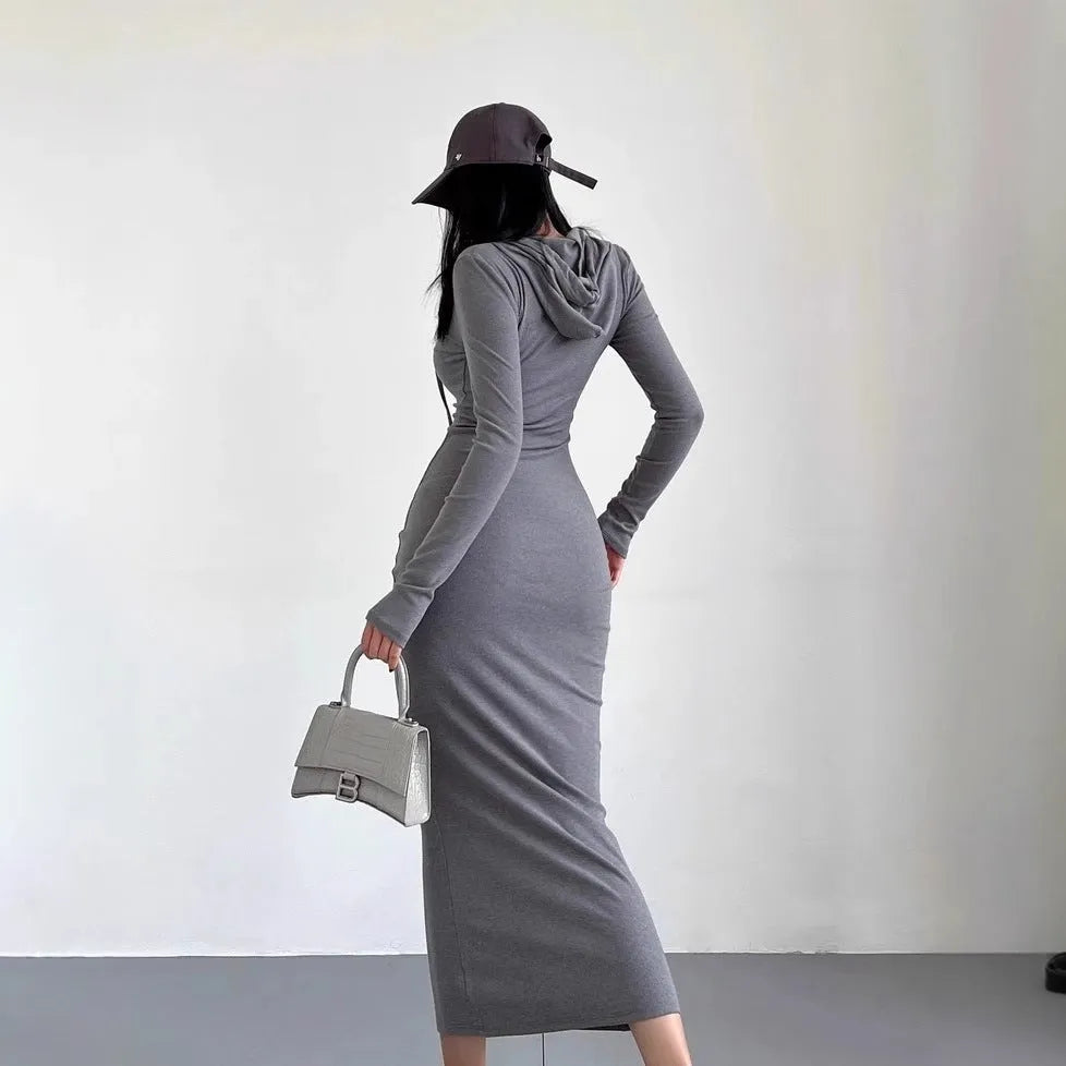 A woman's grey hooded long sleeve sheath dress with an over-the-knee length and high waist.
