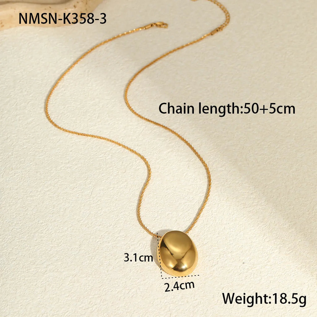 Gold-plated geometric pendant long necklace with adjustable chain on dark background