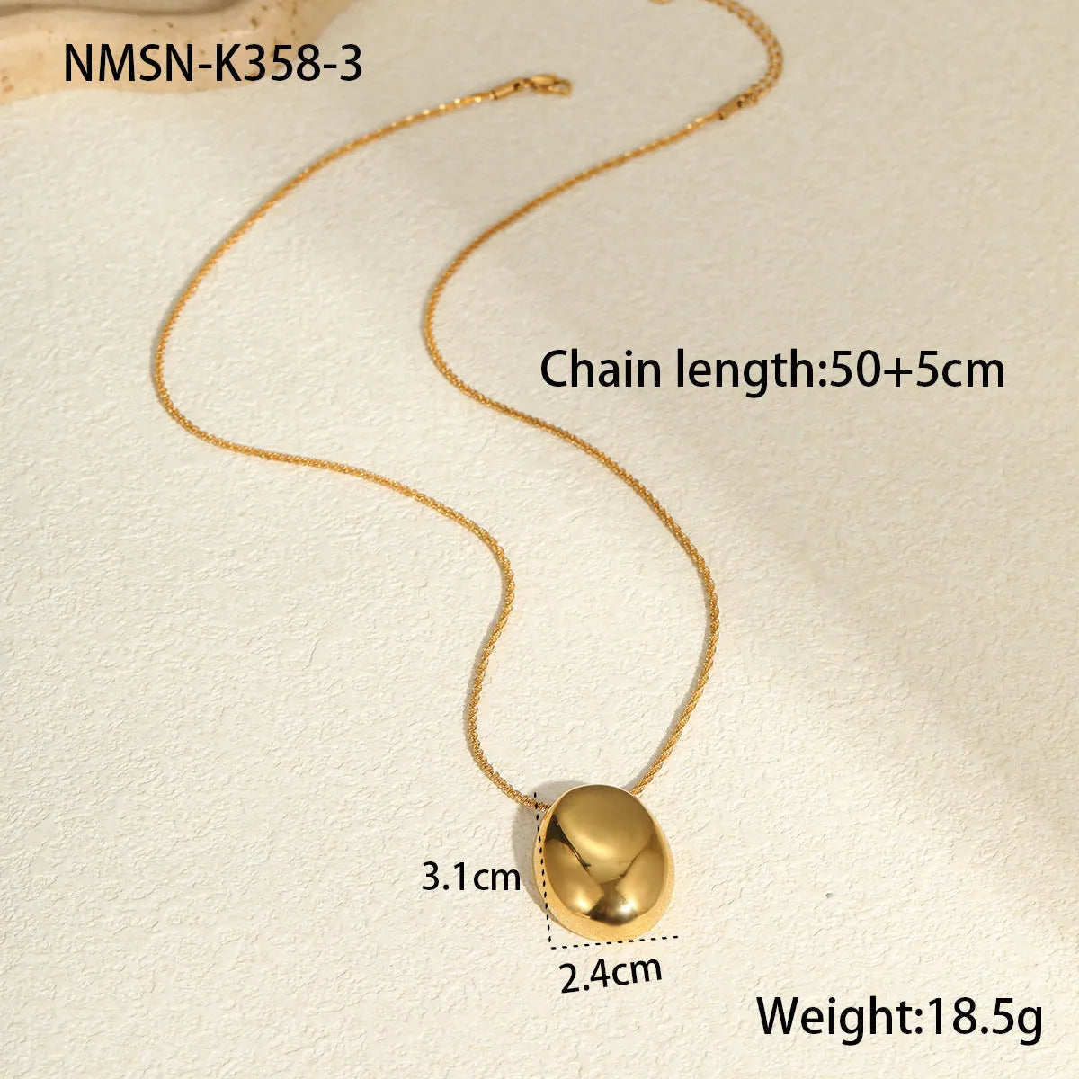 Gold-plated geometric pendant long necklace with adjustable chain on dark background