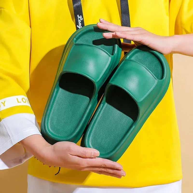 Thickened EVA flip-flop slippers in multiple colours showing the sole thickness.