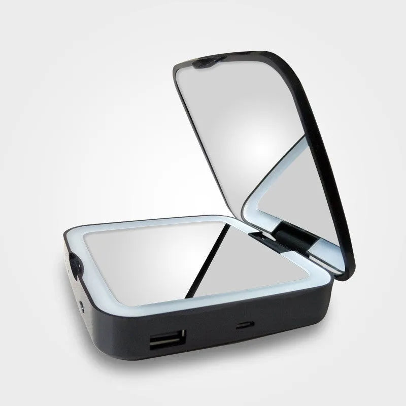 Black and white lighted vanity makeup mirror showing dual-sided design with magnification and adjustable colour temperature dial.
