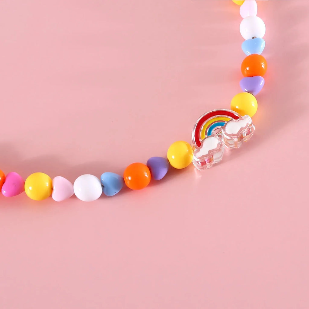 Colourful plastic bead cat necklace with adjustable sizing in peach, rainbow or small flower patterns