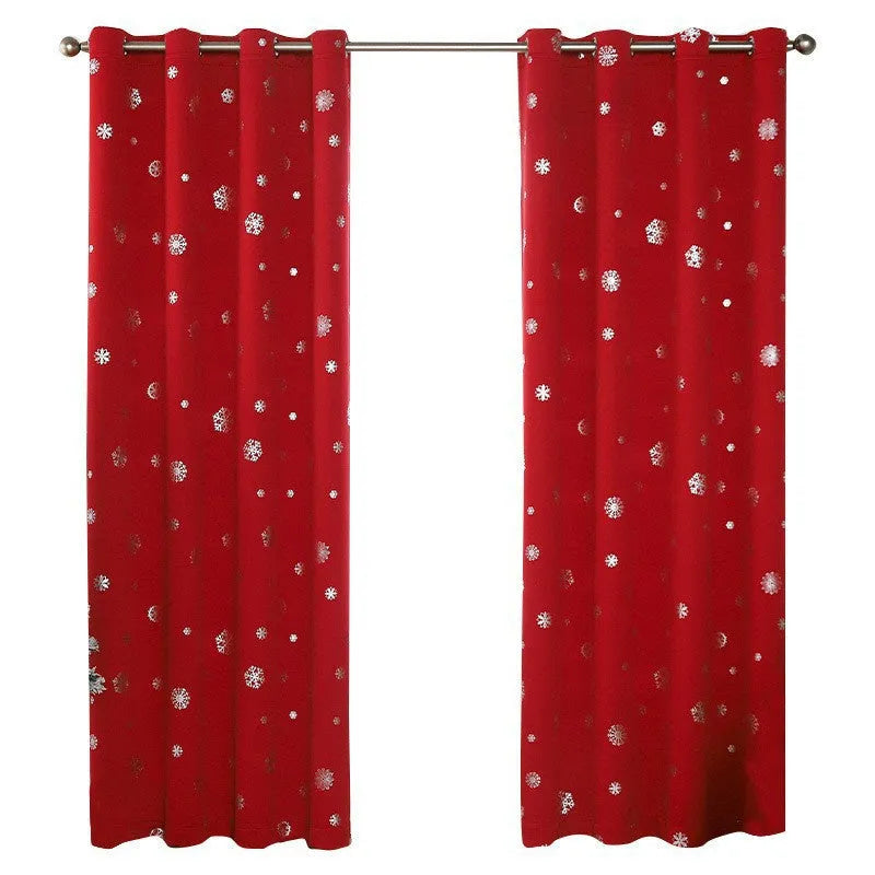 Red polyester snowflake pattern shade cloth curtain with lace loops hanging in modern interior setting