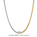 Close-up of a 3mm wide golden snake bone chain necklace with a geometric design on a dark background.