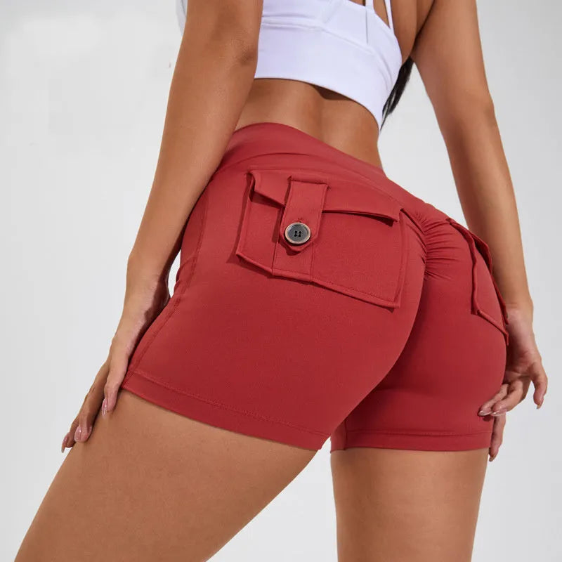 Women's high waist nylon fitness shorts with pockets in avocado green colour.