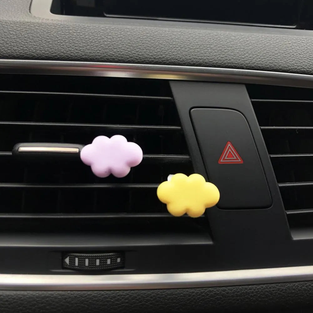 Resin cartoon Baiyun design car air vent fragrance clip in light green colour.