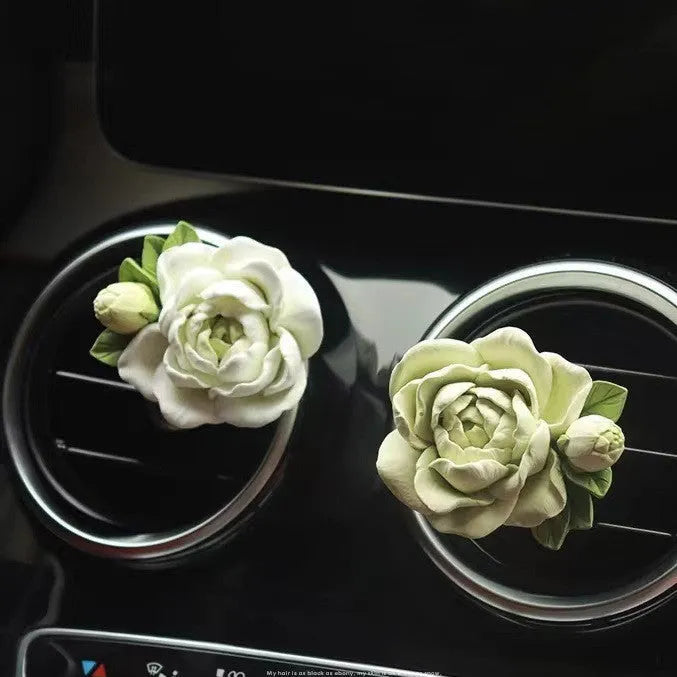 Jasmine car perfume solid air outlet freshener in off white or fresh green colour on car vent