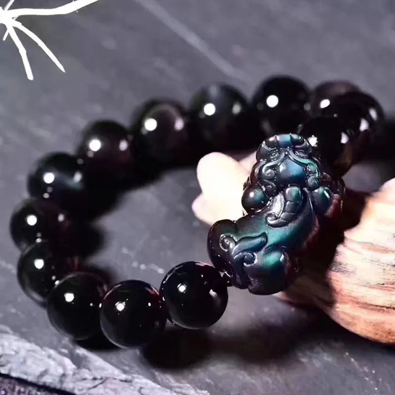 Natural ice colour obsidian crystal bead bracelet showing different bead size options on a wrist.
