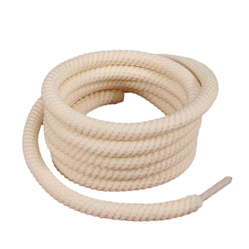 Round woven shoelaces in white, beige and black colours showing 10mm diameter construction