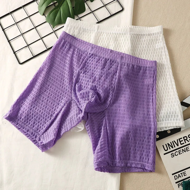 Men's solid colour lace boxer shorts in a lengthened, hip-lifting design on a white background.