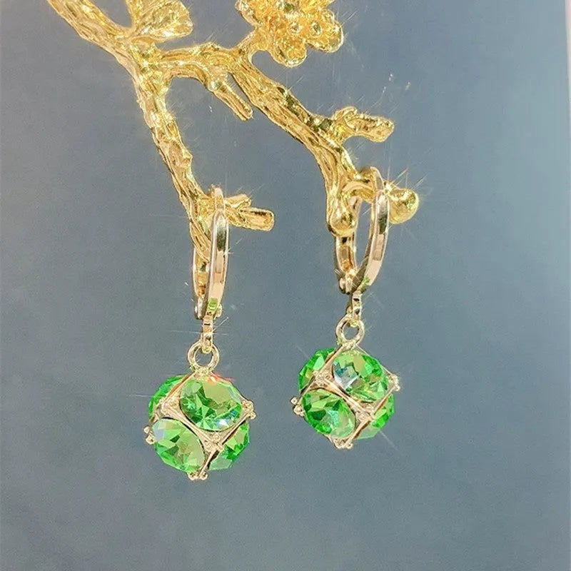 A pair of women's geometric copper earrings with rose details and an electroplated finish.