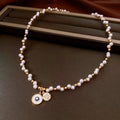 Real gold electroplated pendant necklace with round zircon-inlaid imitation pearl on adjustable clavicle chain