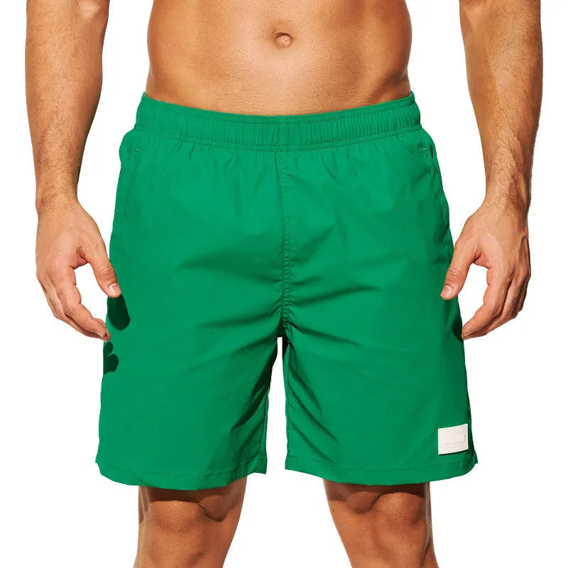 Men's quick-drying nylon sports shorts with straight leg opening in solid colours