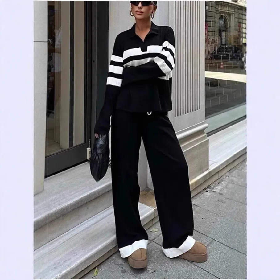Women's black and white striped knitted two-piece set with polo collar top and matching trousers