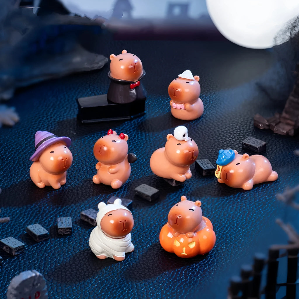 Eight Halloween capybara resin decorations showing pumpkin, zombie, ghost, mummy, vampire, witch hat, devil and skull designs