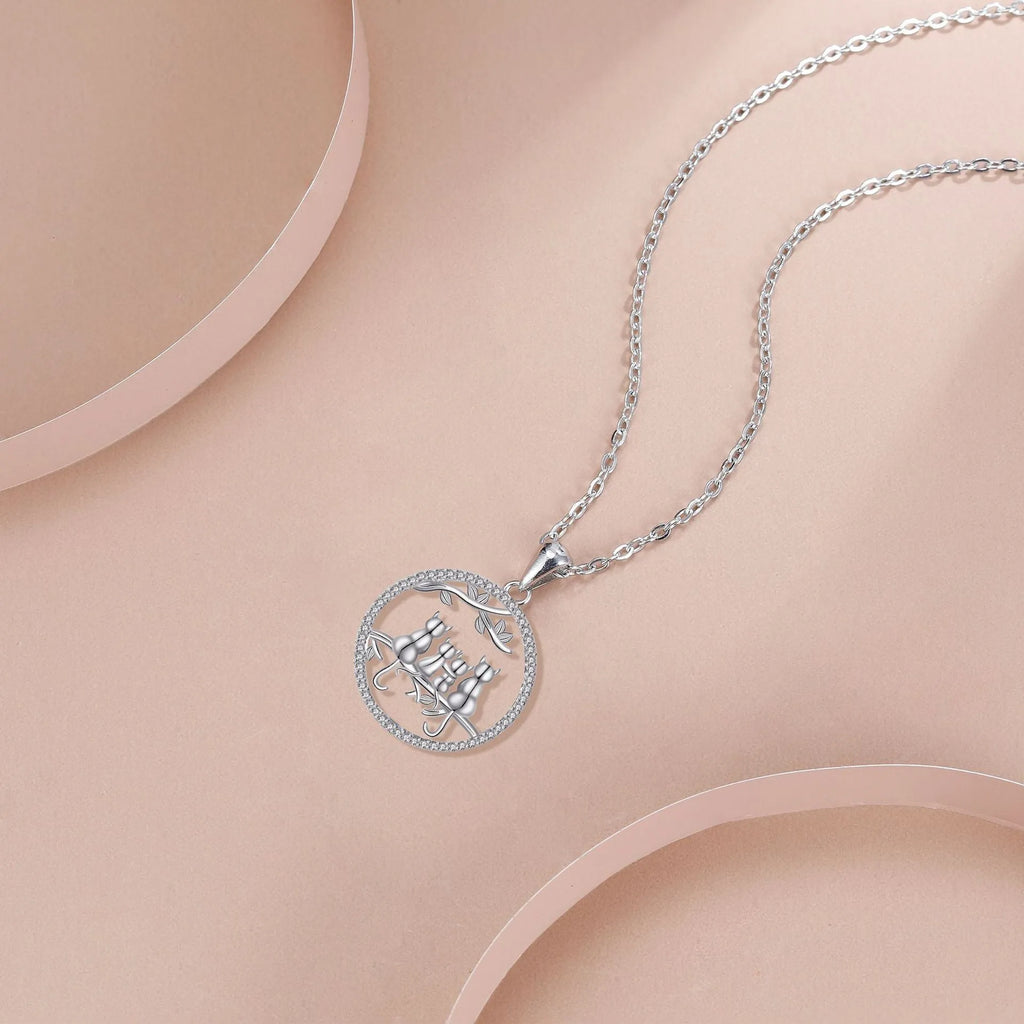 Women's four kitten necklace on copper cross chain with electroplated finish