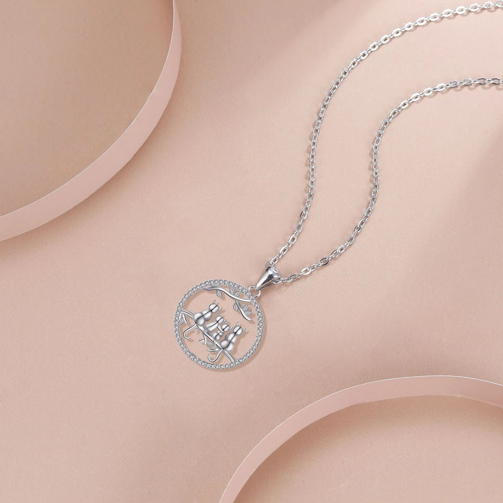 Women's four kitten necklace on copper cross chain with electroplated finish