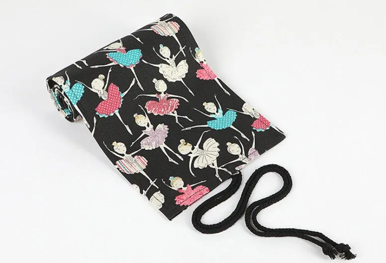 Canvas roll-up pencil case with ballet girl print, shown unrolled to display multiple pencil loops.