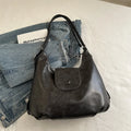 Brown textured PU one-shoulder bag with single strap showing internal phone compartment and horizontal organisation