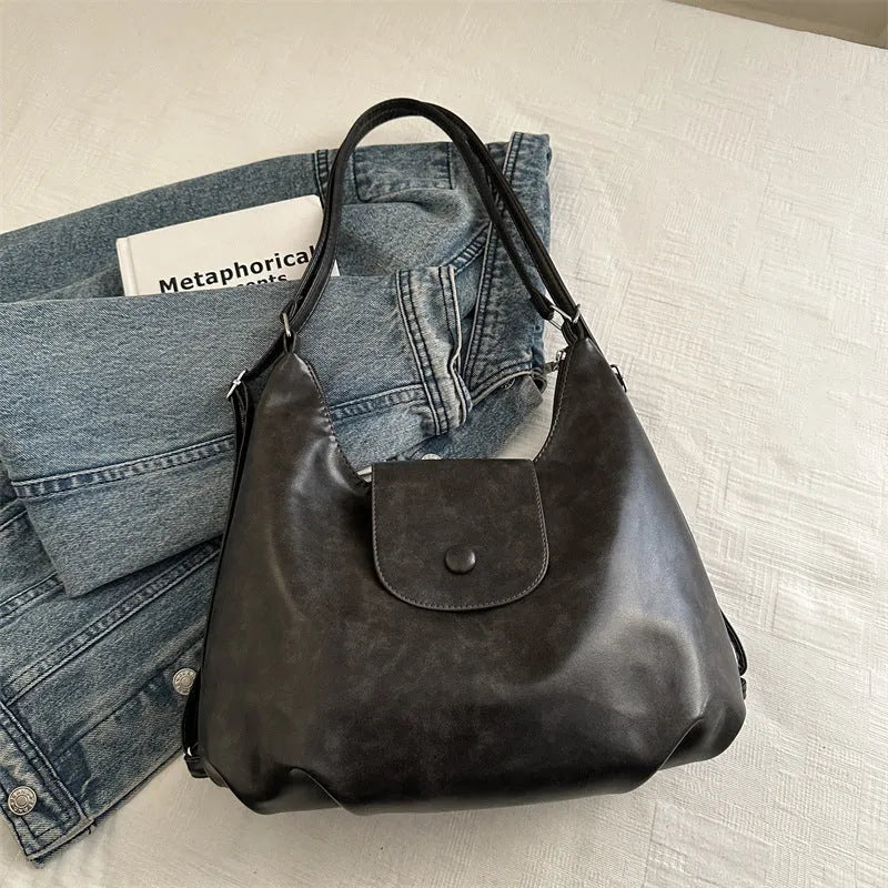 Brown textured PU one-shoulder bag with single strap showing internal phone compartment and horizontal organisation