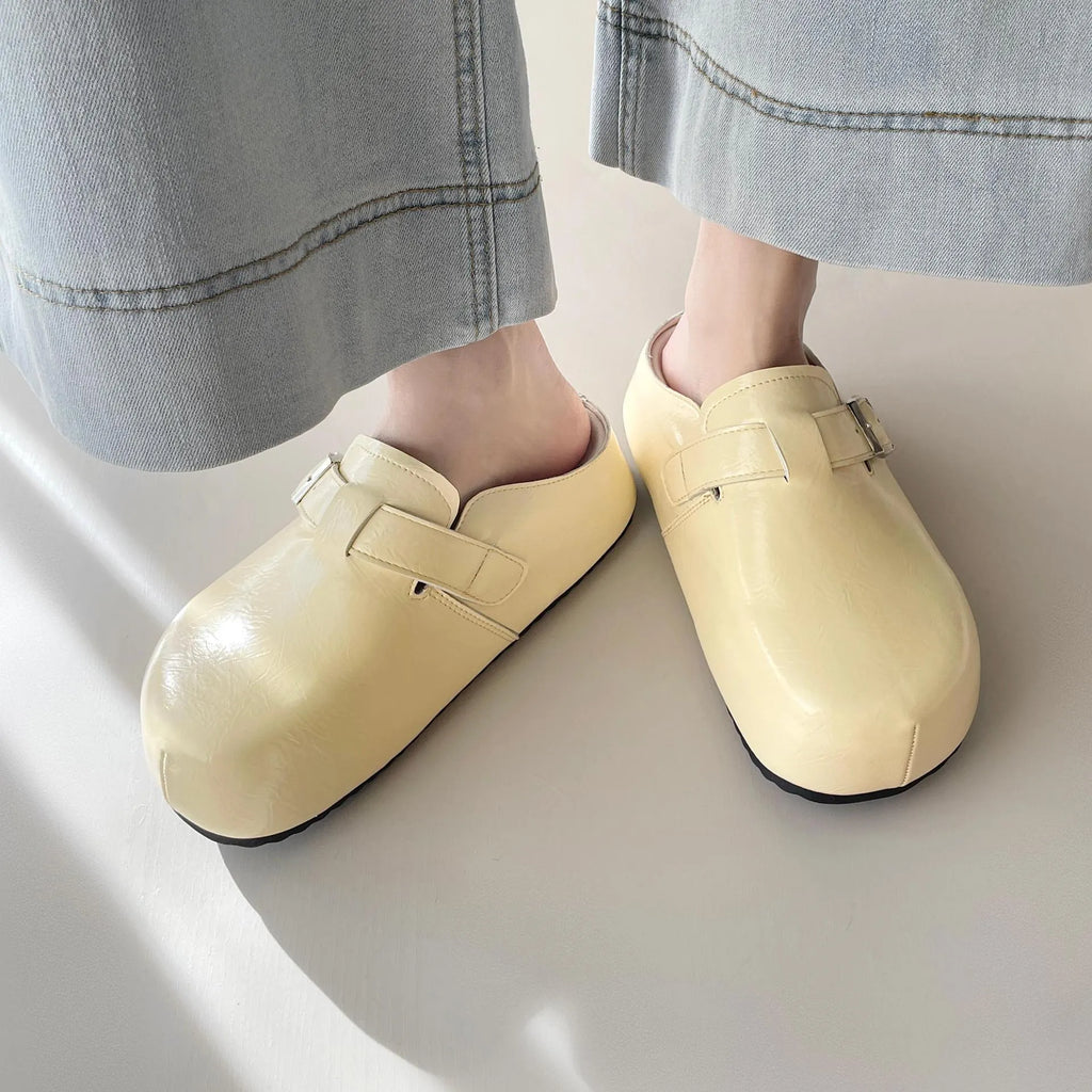 Flat casual sneakers with a buckle fastening and round toe in multiple colour options.
