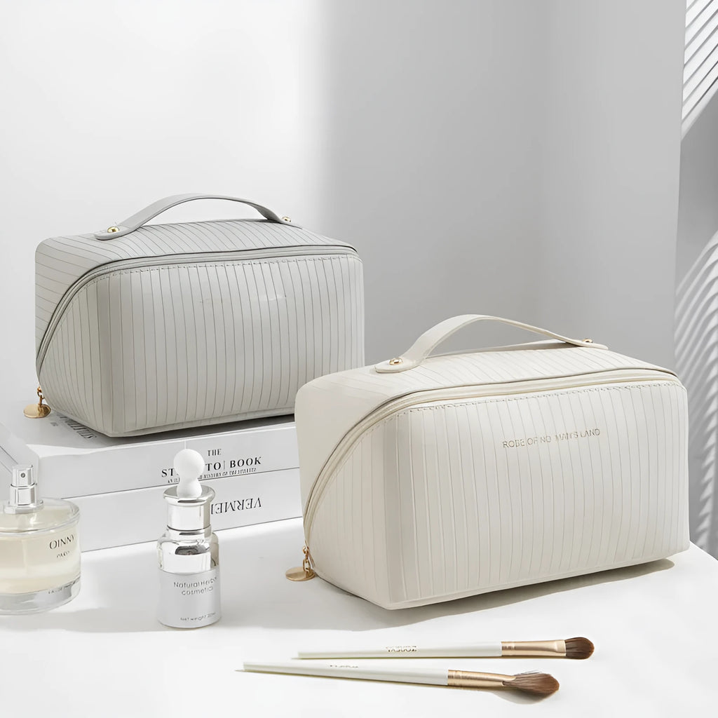 Vertical striped cubic makeup bag in beige with 22.5cm dimensions showing open interior