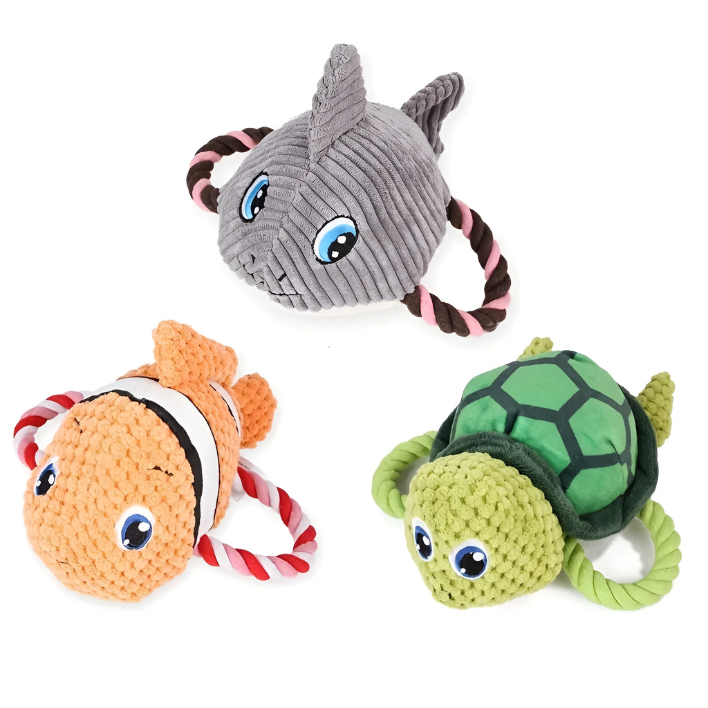 Grey, green, and orange turtle-shaped plush dog toy showing its knotted rope centre.