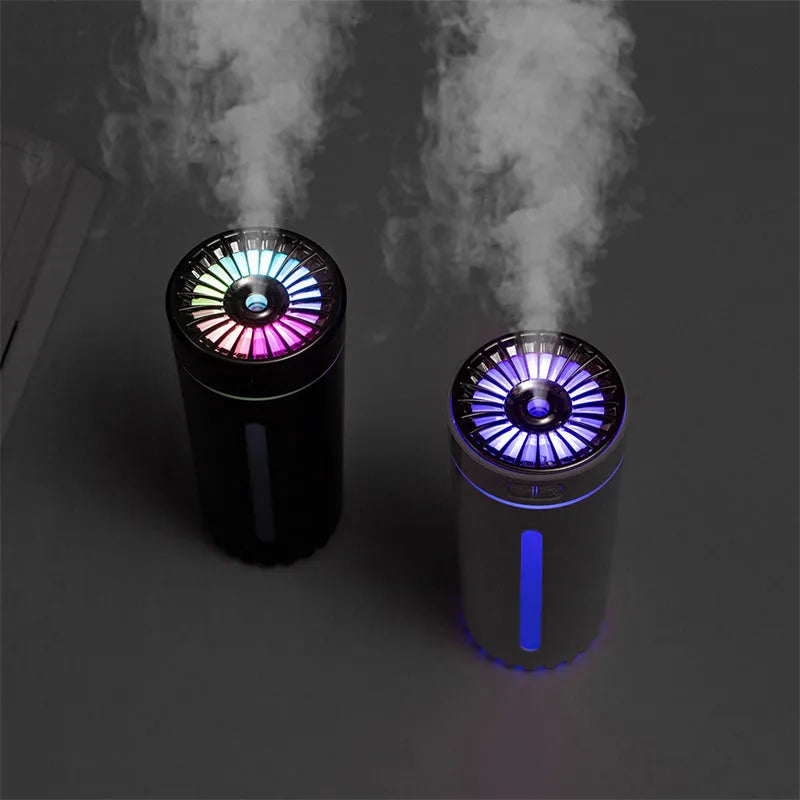 Black USB rechargeable ultrasonic humidifier with LED lights on a car cup holder