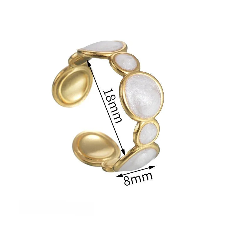 A geometric-shaped adjustable ring made from stainless steel with an electroplated metallic finish.